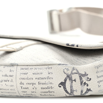 X Daniel Arsham Grained Calfskin Newspaper Print Saddle Bag White