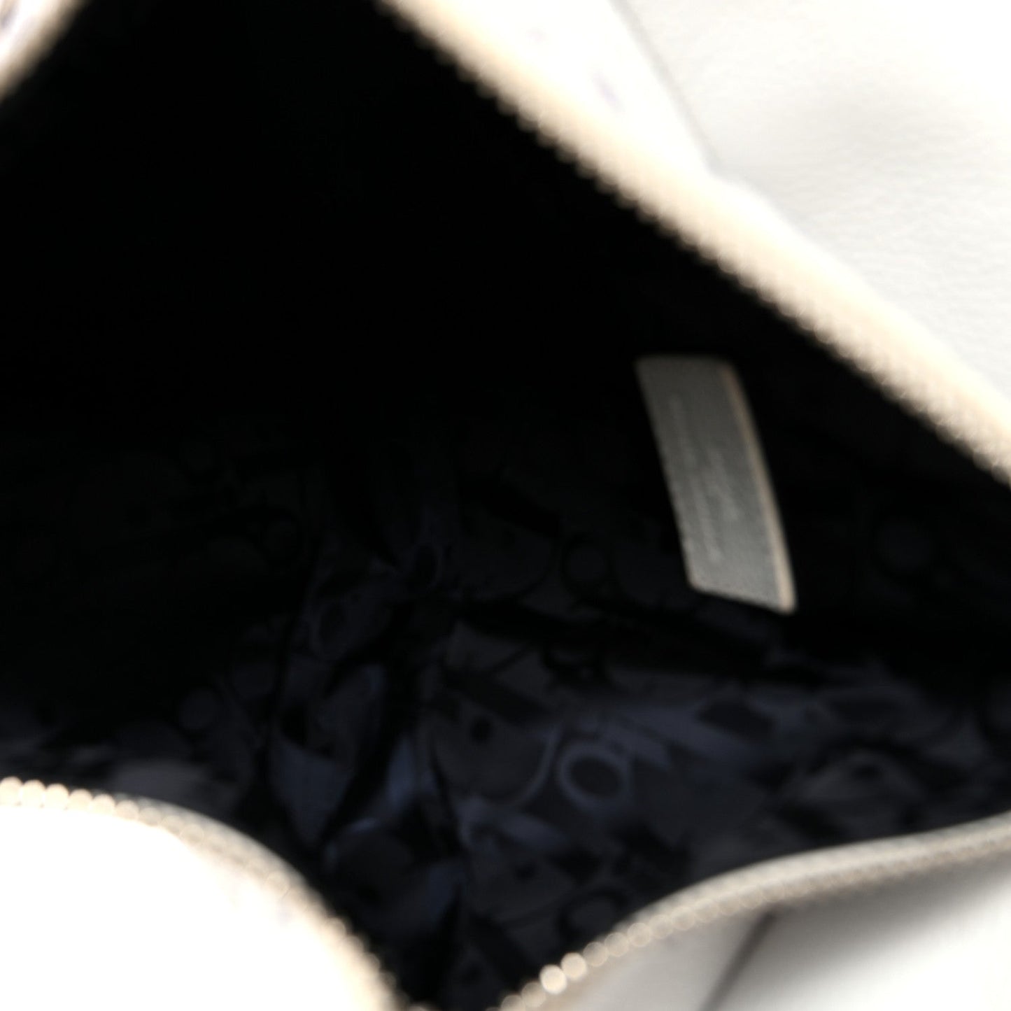 X Daniel Arsham Grained Calfskin Newspaper Print Saddle Bag White