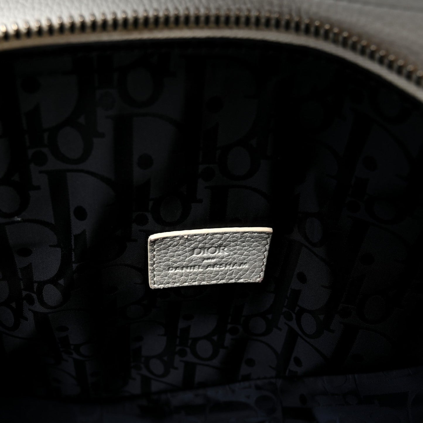 X Daniel Arsham Grained Calfskin Newspaper Print Saddle Bag White