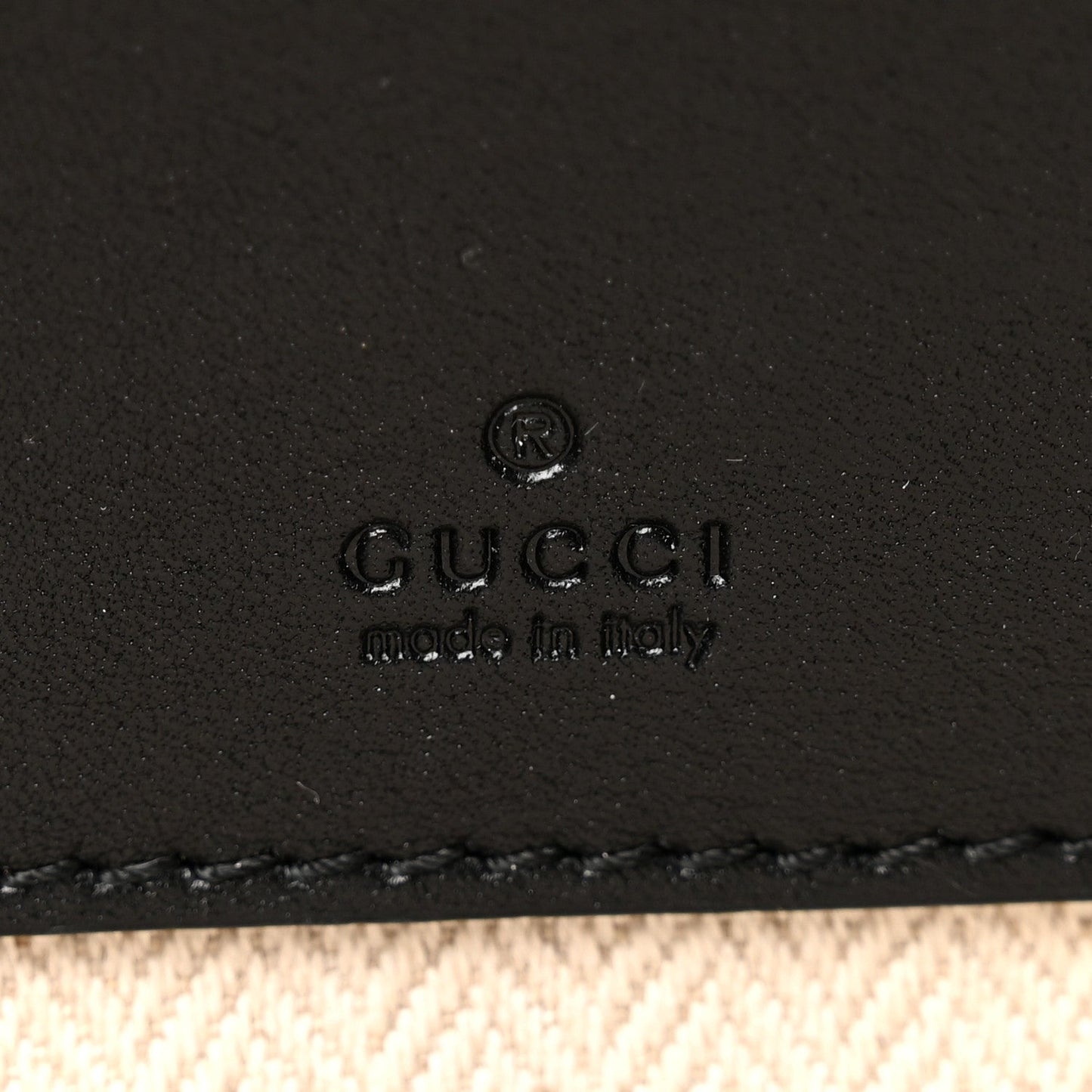 GG Supreme Monogram Textured Calfskin Emblem Mini Crossbody Black