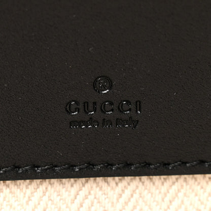 GG Supreme Monogram Textured Calfskin Emblem Mini Crossbody Black